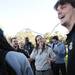 Busch Garden Animal Care Specialist Sarah Benoit smiles as she jokes with Michigan offensive linesman Taylor Lewan after the team fed giraffes at the park in Tampa, Fla. on Saturday, Dec. 29. Melanie Maxwell I AnnArbor.com